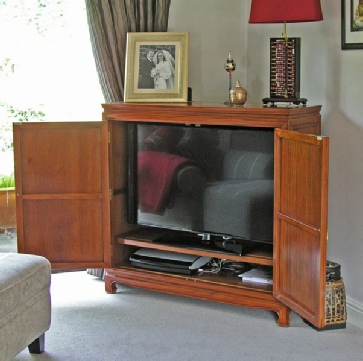Bespoke TV cabinet - with solid rosewood longlife carved doors - open.