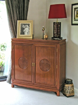 TV cabinet, custom made in solid rosewood with Longevity carved doors - closed view