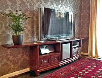 Individual designed TV cabinet, solid rosewood with hand carved doors.