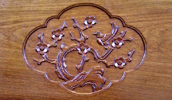 bird and flower carving on rosewood panel