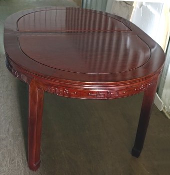 Large Chinese Oval table seating 10-14, solid rosewood with carved key design on apron