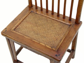 Chinese antique chair showing restored cane seat, viewed from above.