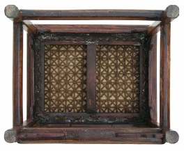 Chinese antique chair showing restored cane seat, viewed from below.