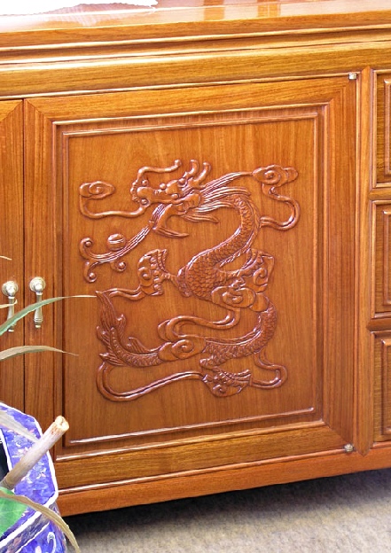 hand carved dragon on chinese rosewood cabinet