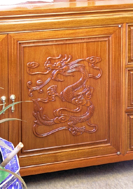 hand carved dragon on chinese rosewood cabinet