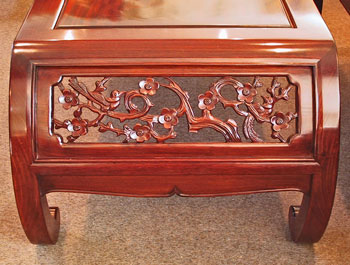 Curved coffee table with hand carved bird & floweropen carving.
