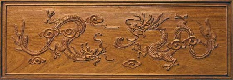 hand carved dragon on rosewood desk