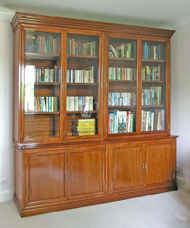 Bespoke book case in solid rosewood, one of a pair.