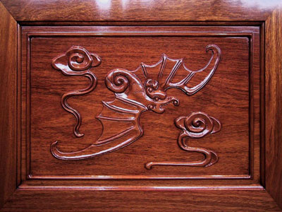 bat carving on the end of Chinese camphorwood lined rosewood chest